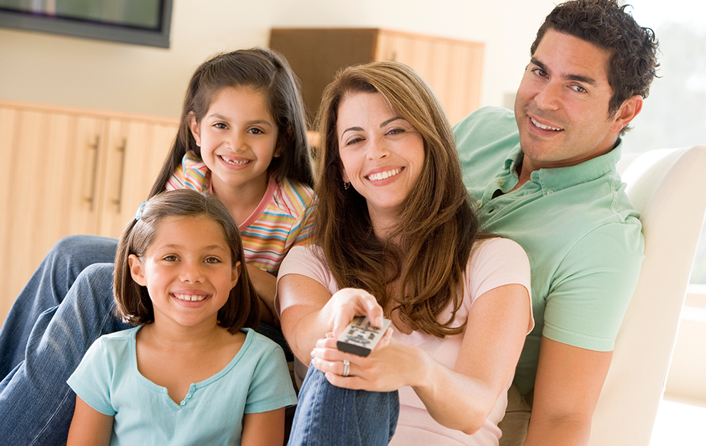 family with a tv remote